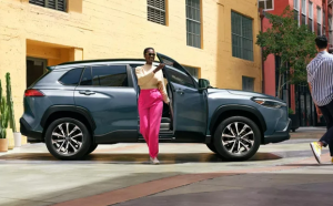 lady getting out of 2022 Toyota Corolla Cross in Silver Spring, MD