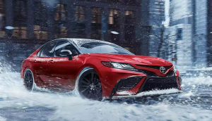 Red 2023 Toyota Camry Driving in Silver Spring, MD